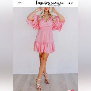 Women’s pink dress from Impressions online boutique. Size medium